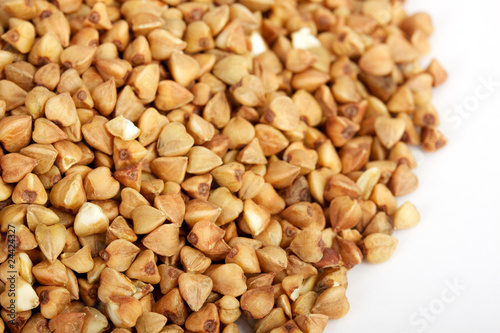 Photo: Buckwheat seeds closeup isolated on white Buckwheat seeds closeup isolated on white