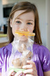 portrait of a girl holding an easter bunny in front of her face