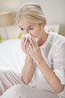 close-up of a woman suffering from cold