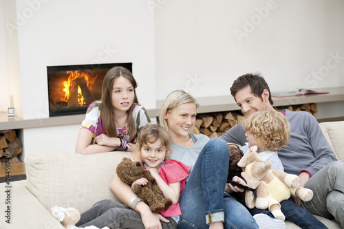 Photo: family watching television family watching television