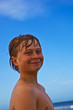 smiling happy boy at the beach