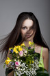 Beauty with a bunch of flowers