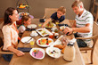 Photo: some more bread please - family having breakfast some more bread please - family having breakfast