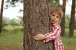 little boy embrace a tree