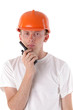 workman talking on portable UHF radio transceiver