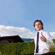 Young realtor with blue skies