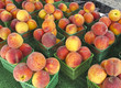 Organic Peaches for sale at outdoor farmers market