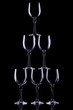 Composition from crystal glasses for wine on a black background