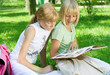 Two School Girls Reading the Book outdoor