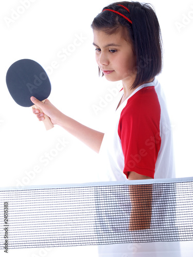 Photo: cute girl playing table tennis isolated on white background cute girl playing table tennis isolated on white background