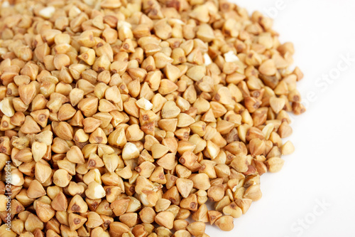 Photo: Buckwheat seeds closeup isolated on white Buckwheat seeds closeup isolated on white