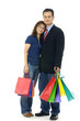 Couple with shopping bags over white