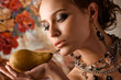 Photo: Elegant woman with pear. Elegant woman with pear.