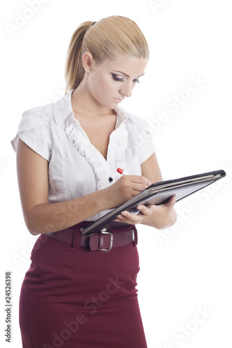young beautiful woman signing a document