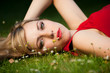 pretty girl laying on a meadow