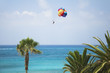 Bright parachute above the sea