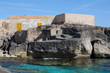 Haus auf Felsen am Meer