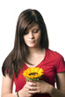 Young girl holding sunflower