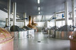brewery workshop with copper and stainless fermentation vats