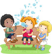 Children Blowing Bubbles In The Park