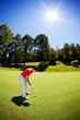 Young white male golfer red shirt