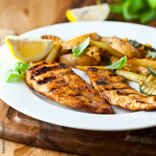 Photo: Grilled chicken breast with vegetables and lemon Grilled chicken breast with vegetables and lemon