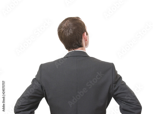 Photo: back of pensive businessman looking up isolated on white back of pensive businessman looking up isolated on white
