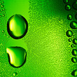 Green water drops background. Square composition.