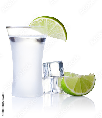 Photo: shot glass filled with clear cold alcohol shot glass filled with clear cold alcohol