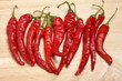 Red Hot Cayenne Peppers on Wood Cutting Board