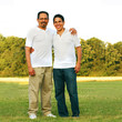 Father and son full body portrait at the park