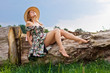 Young beautiful girl with hat posing outdoor
