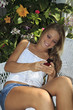 beautiful teenage girl texting on her cell phone