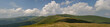 White summer clouds above Carpathian mountain meadows panorama White summer clouds above Carpathian mountain meadows panorama