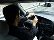 Young Man Driving Car