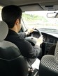 Young Man Driving Car