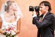 Husband taking picture of his wife