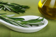 Rosemary on spoon with olive oil (Selective Focus)