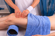 Young man gets thigh massage Young man gets thigh massage