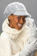 Fashionable Woman Wearing Knitwear And Cap In Studio