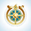 Golden compass rose with globe and ribbon