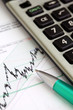 Stock graphic with pen and calculator