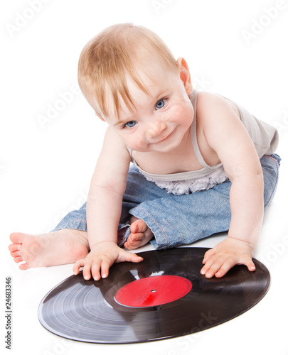 Photo: The small child with a black gramophone record The small child with a black gramophone record