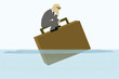 failed business man on floating briefcase