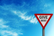 Photo realistic ' give way' sign, against a bright blue sky