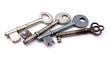 Row of four keys on white surface Row of four keys on white surface