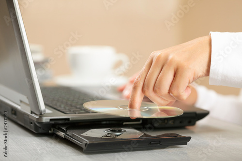 Foto: Woman hand with CD Woman hand with CD