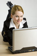 lying businesswoman with a notebook lying businesswoman with a notebook