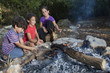 three kids in a campfire