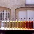 Bottles with transparent, yellow and red color in front